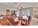 Inviting living room features hardwood floors, comfortable seating, and French doors leading to the outdoor space at 3411 Knoxville Pl, Plant City, FL 33566