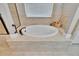 Bathroom with soaking tub and large window at 3411 Knoxville Pl, Plant City, FL 33566