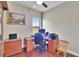 Office space with ceiling fan, wood floors, desk, and outdoor view at 3411 Knoxville Pl, Plant City, FL 33566