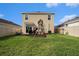 Large backyard with a playset, green grass, and privacy fence at 3528 Maple Grove Way, Plant City, FL 33565