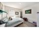 Cozy bedroom with striped bedding, plush toys, and natural light at 3528 Maple Grove Way, Plant City, FL 33565