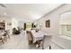 Open-concept dining area with views of the living room and backyard at 3528 Maple Grove Way, Plant City, FL 33565