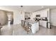 Open kitchen with granite countertops, stainless steel appliances, and white cabinetry at 3528 Maple Grove Way, Plant City, FL 33565