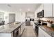 Spacious kitchen featuring granite countertops, stainless steel appliances, and white cabinets at 3528 Maple Grove Way, Plant City, FL 33565
