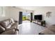 Bright living room featuring tile floors, and sliders leading to the backyard at 3528 Maple Grove Way, Plant City, FL 33565