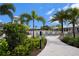 Relax by the community pool surrounded by lush landscaping and swaying palms, a perfect tropical retreat at 3528 Maple Grove Way, Plant City, FL 33565