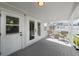 Long back porch with access to green backyard at 4002 W Watrous Ave, Tampa, FL 33629