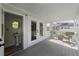 Back porch opens to a half bath and covered seating area at 4002 W Watrous Ave, Tampa, FL 33629