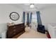 Bright Bedroom with wood floors, a ceiling fan, and abundant natural light at 4002 W Watrous Ave, Tampa, FL 33629