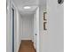 Bright hallway featuring wood-look floors and neutral paint at 4002 W Watrous Ave, Tampa, FL 33629