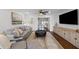 Cozy living room featuring a comfortable gray sofa, ottoman, and stylish decor at 4002 W Watrous Ave, Tampa, FL 33629