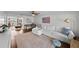 Open-concept living area featuring a study space, comfortable sofa, and abundant natural light at 4002 W Watrous Ave, Tampa, FL 33629