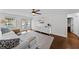 Sunlit living area with a large window, patio access, and a modern entertainment center at 4002 W Watrous Ave, Tampa, FL 33629
