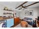 Unique living space with a mini bar, exposed beams, and a comfortable sitting area at 4002 W Watrous Ave, Tampa, FL 33629