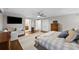 Large main bedroom with a walk-in closet, hardwood floors, and a sitting area at 4002 W Watrous Ave, Tampa, FL 33629