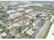 Elevated aerial perspective revealing the expansive community layout, interspersed with green spaces, water features, and ample parking at 4014 Ashford Green Pl # G103, Tampa, FL 33613
