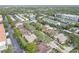 Expansive aerial view of the community with lush landscapes, multiple buildings and a serene water feature and pool at 4014 Ashford Green Pl # G103, Tampa, FL 33613