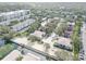 Extensive aerial view of the community, showcasing the layout with green spaces, parking, and a variety of residential buildings at 4014 Ashford Green Pl # G103, Tampa, FL 33613