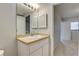 Well-lit bathroom features neutral countertop vanity at 4014 Ashford Green Pl # G103, Tampa, FL 33613