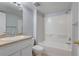 Functional bathroom with neutral countertop vanity, tub and shower at 4014 Ashford Green Pl # G103, Tampa, FL 33613
