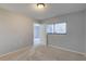 Inviting bedroom with neutral-colored walls, cozy carpeting, and a window providing natural light at 4014 Ashford Green Pl # G103, Tampa, FL 33613