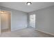 Bright bedroom with neutral carpet, gray walls, a window and closet at 4014 Ashford Green Pl # G103, Tampa, FL 33613