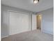 Cozy bedroom featuring neutral carpet, light gray walls and a closet at 4014 Ashford Green Pl # G103, Tampa, FL 33613