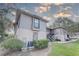 Two story condo featuring neutral exterior paint and black iron staircases leading to the second level units at 4014 Ashford Green Pl # G103, Tampa, FL 33613