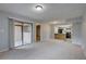 Open floor plan with sliding glass door to the patio and bar seating into the kitchen at 4014 Ashford Green Pl # G103, Tampa, FL 33613