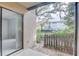 View from the patio showcasing a cozy outdoor space with a partial fence and a glimpse of the community beyond at 4014 Ashford Green Pl # G103, Tampa, FL 33613