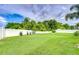 Expansive backyard with lush green grass and a white fence, perfect for outdoor activities and relaxation at 4211 Elba Pl, Valrico, FL 33596
