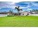 Spacious backyard with well-maintained lawn and a screened-in pool area, great for outdoor enjoyment at 4211 Elba Pl, Valrico, FL 33596