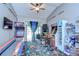 Fun game room featuring a variety of arcade games and a door to the backyard at 4211 Elba Pl, Valrico, FL 33596