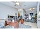 Open-concept space with an office area connected to a colorful arcade and game room at 4211 Elba Pl, Valrico, FL 33596