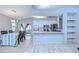 Bright eat-in kitchen featuring an island, appliances, and adjacent dining area at 4211 Elba Pl, Valrico, FL 33596