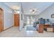 Inviting living area featuring a hardwood front door, tiled floors, and view to an office space at 4211 Elba Pl, Valrico, FL 33596