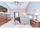 Spacious main bedroom featuring large bed, dresser, and a sliding glass door to a balcony at 4211 Elba Pl, Valrico, FL 33596