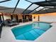 Enclosed pool area with lounge chairs, perfect for relaxation and sunbathing by the water at 4211 Elba Pl, Valrico, FL 33596