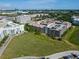 Aerial view of the community, with parking garage, green space, and city skyline in the background at 4221 W Spruce St # 2218, Tampa, FL 33607