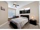 Comfortable bedroom with ceiling fan, city views and modern decor at 4221 W Spruce St # 2218, Tampa, FL 33607