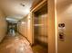 Hallway view with an elevator and tile floors at 4221 W Spruce St # 2218, Tampa, FL 33607