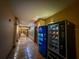 Hallway view with tile floors and a vending machine to the right at 4221 W Spruce St # 2218, Tampa, FL 33607