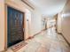 Well lit hallway featuring tile floors and neutral color paint with a door mat at 4221 W Spruce St # 2218, Tampa, FL 33607