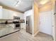 Well-lit kitchen with stainless steel appliances and granite counters at 4221 W Spruce St # 2218, Tampa, FL 33607