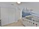 Charming Bedroom featuring a crib and whimsical wall art with light-colored walls and a ceiling fan at 4489 57Th N Ave, St Petersburg, FL 33714