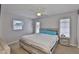 Cozy bedroom with wood-look bedframe, natural lighting, neutral tones, and comfortable decor at 4489 57Th N Ave, St Petersburg, FL 33714
