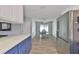 Open dining room with modern flooring and stainless steel refrigerator with bright and natural light at 4489 57Th N Ave, St Petersburg, FL 33714