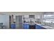 Beautiful kitchen with stainless steel appliances, mosaic backsplash, and white and blue cabinets at 4489 57Th N Ave, St Petersburg, FL 33714