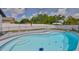 Backyard pool with safety fence, turtle mosaic, and lush landscaping at 4489 57Th N Ave, St Petersburg, FL 33714