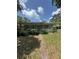 Single-story home featuring a stone facade and a quaint, landscaped front yard at 467 34Th N Ave, St Petersburg, FL 33704